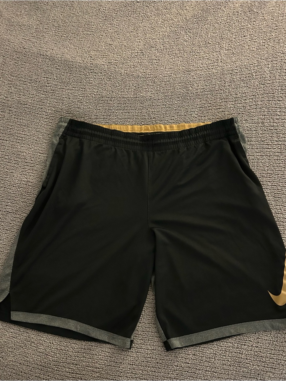 Nike Black Athletic Shorts with Gold Swoosh